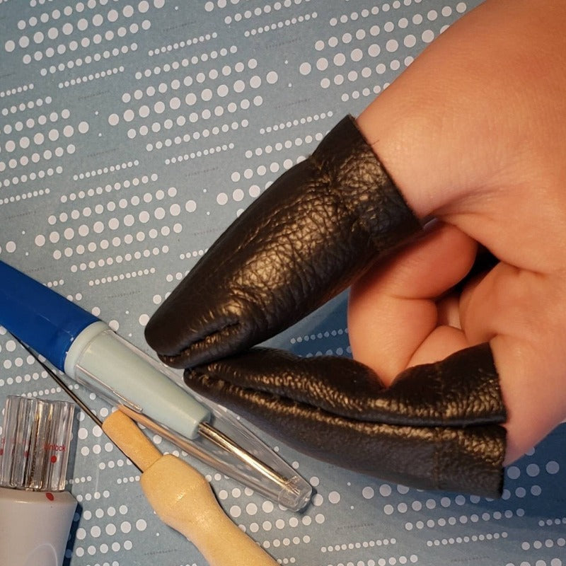 Leather finger covers. No more poked digits. Random colour. Price drops with multiples. Finger protection! Ships from Canada