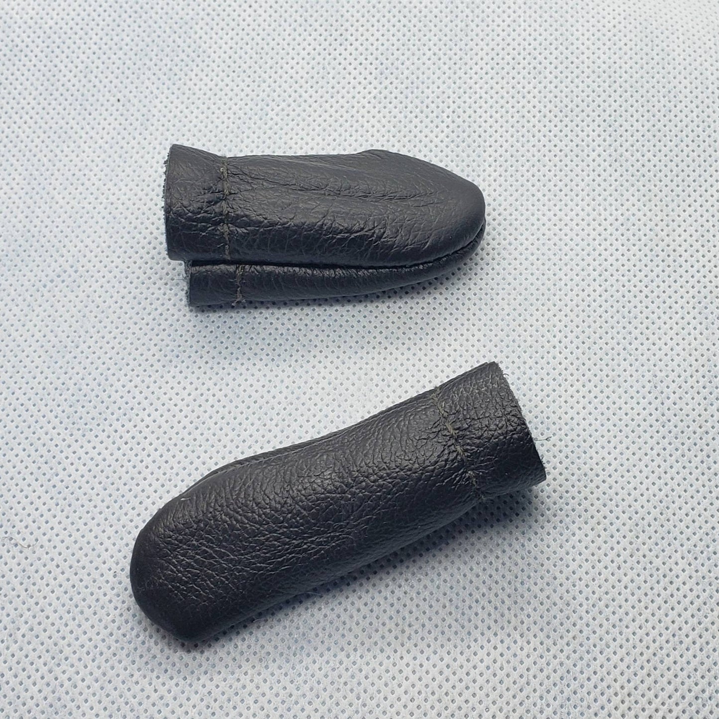 Leather finger covers. No more poked digits. Random colour. Price drops with multiples. Finger protection! Ships from Canada